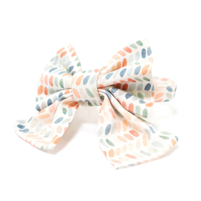 Dog collar with sailor bow in multi-color polka dog print.