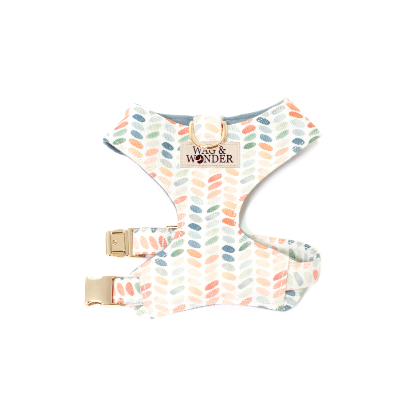 Reversible dog harenss in modern polka dot print shown in size XS with one buckle at chest.