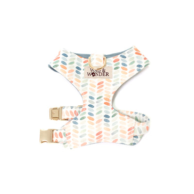 Reversible dog harness in modern dot print with gold hardware shown in size XS.