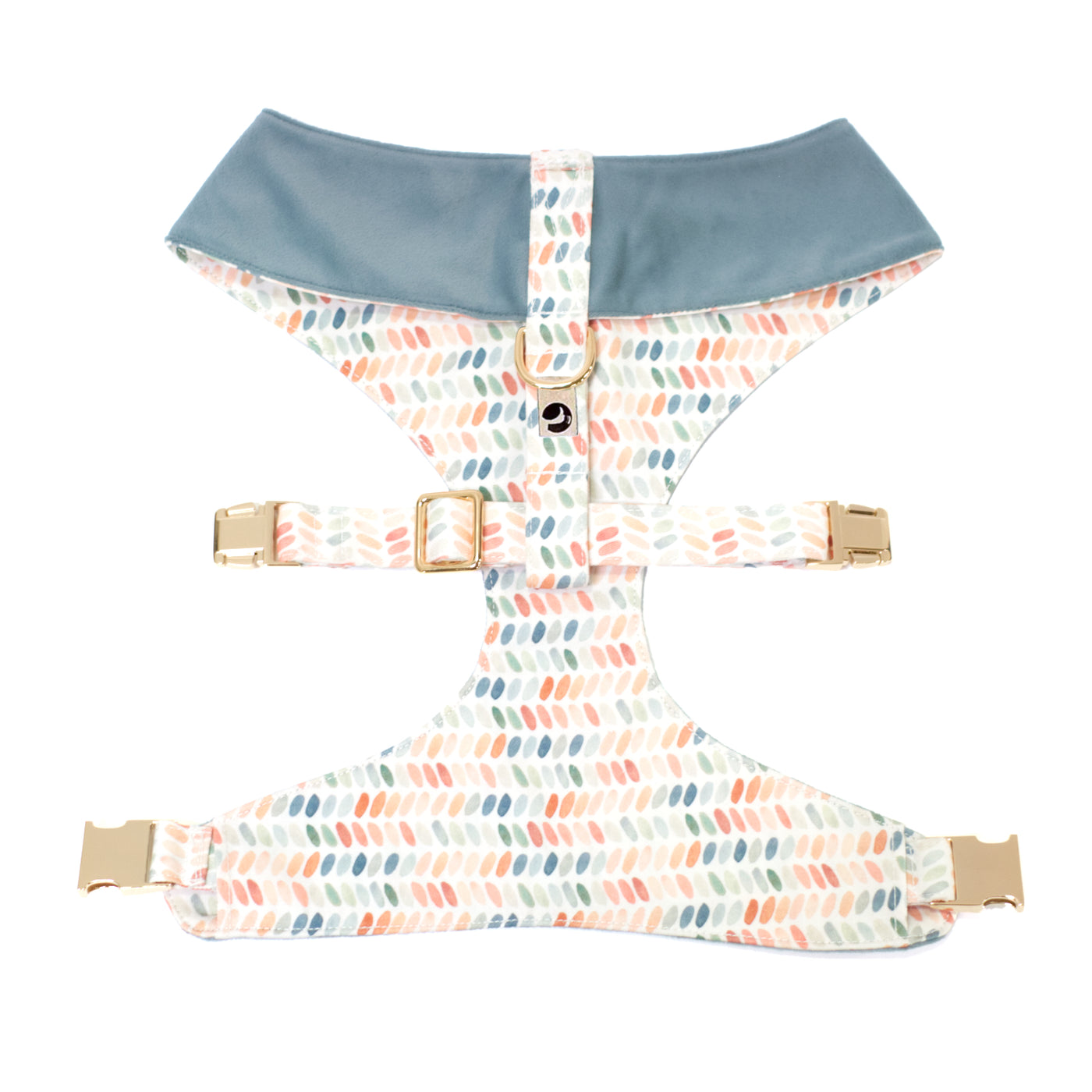 Back/top view of reversible dog harness in blue velvet and blue, rust and green dot print with gold hardware
