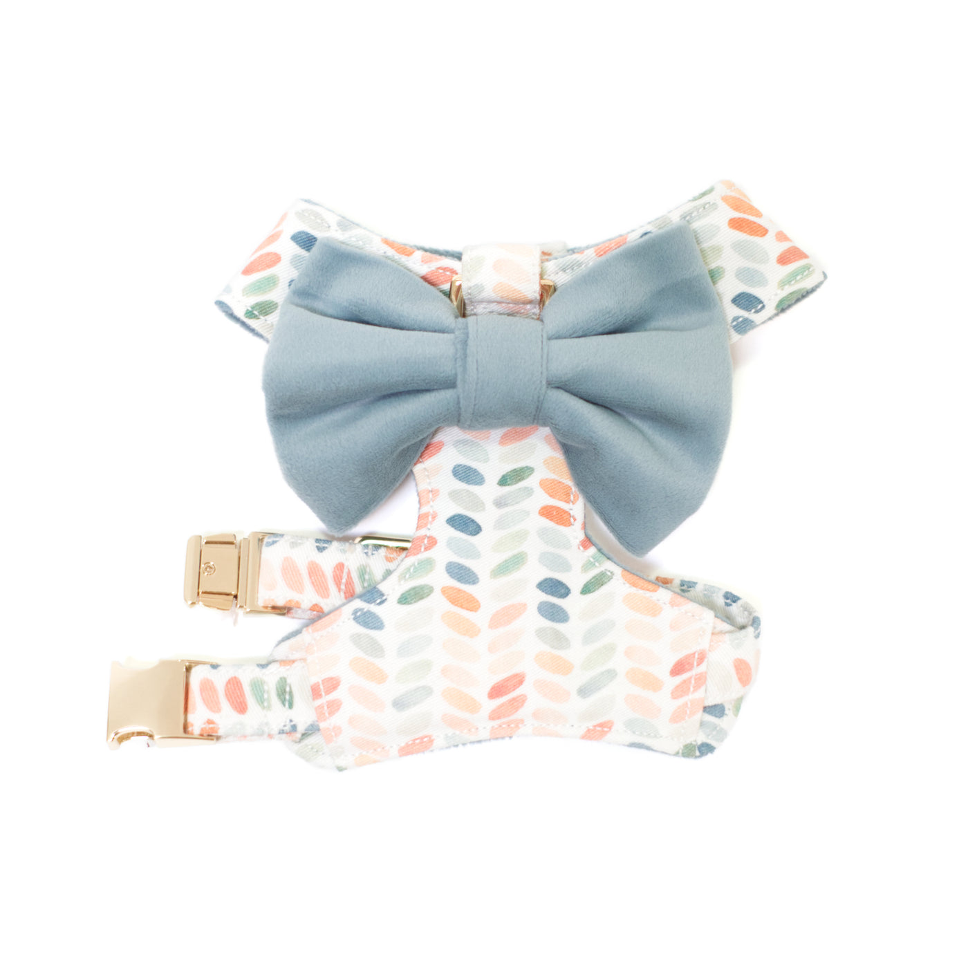 Size XS reversible dot harness in blue, green and terra cotta dot print and blue velvet bow tie.