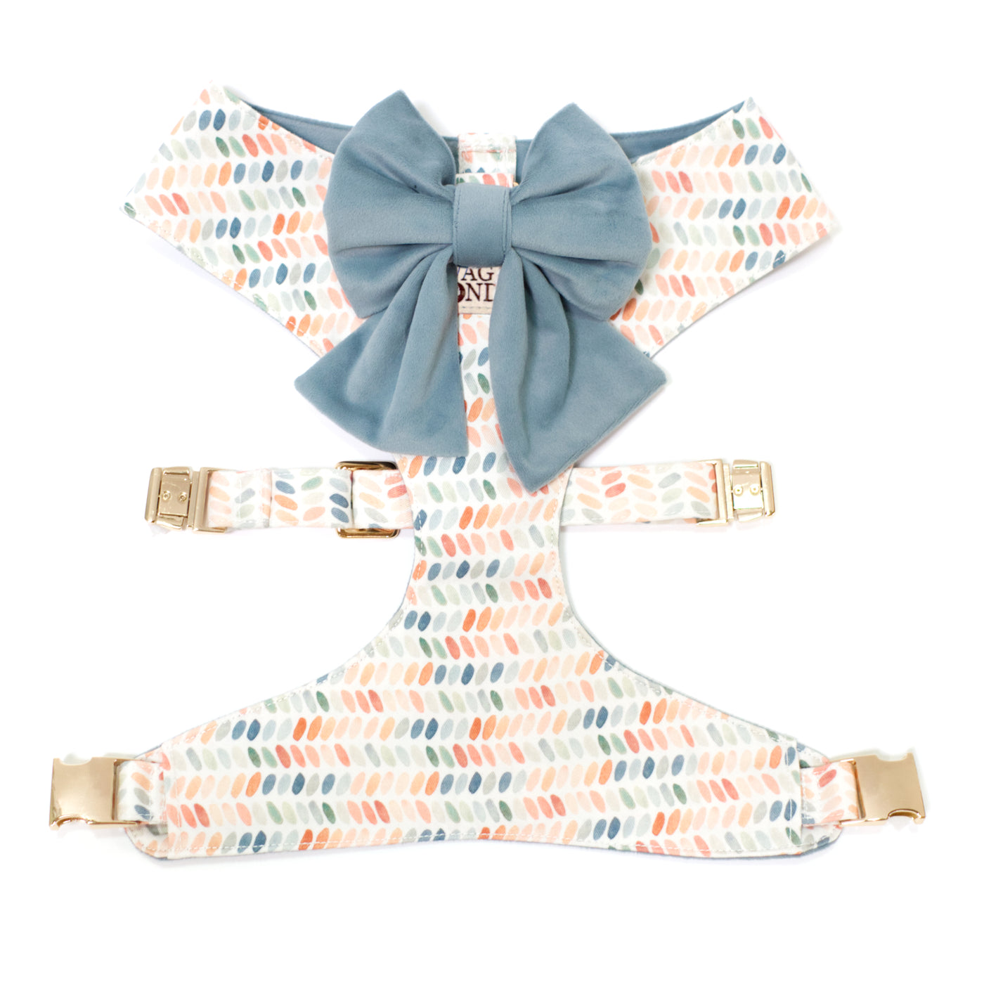 Reversible dog harness in dot print of blues, terra cottas, and greens with a matching blue velvet sailor dog bow.