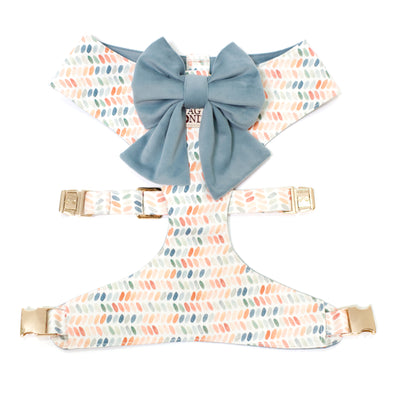 Reversible dog harness in dot print of blues, terra cottas, and greens with a matching blue velvet sailor dog bow.