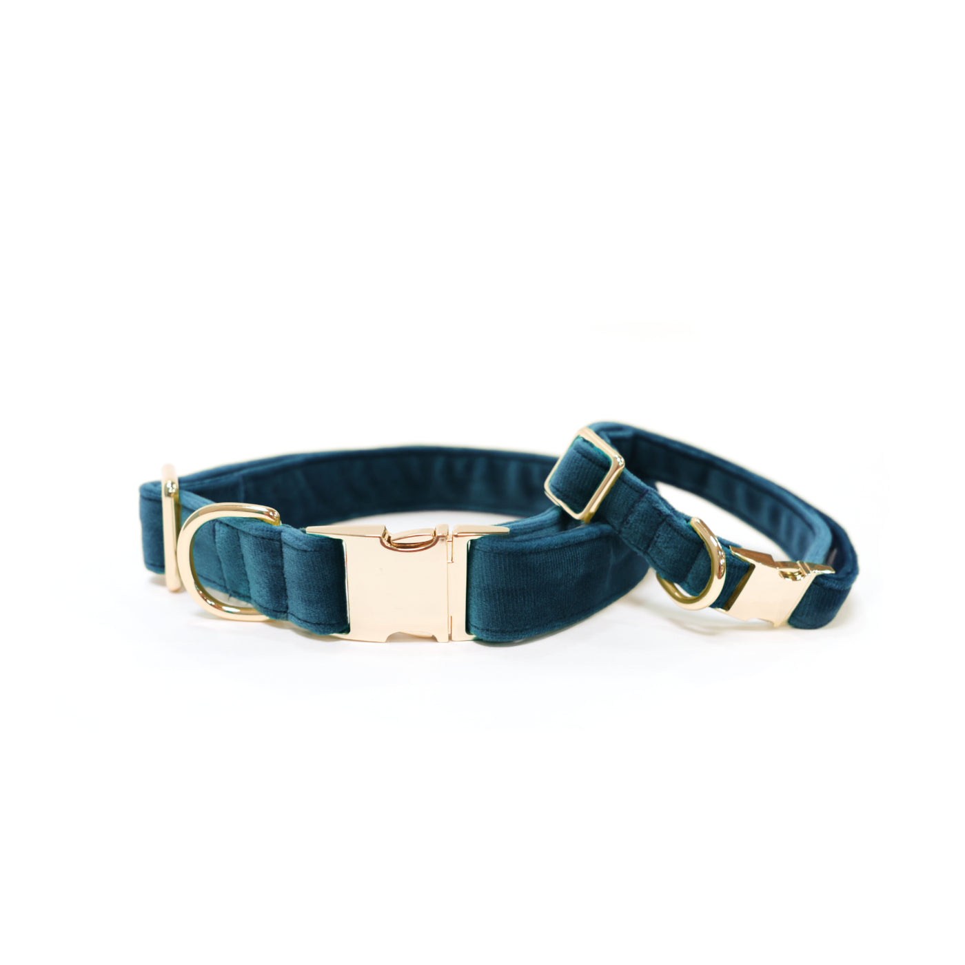 Dark teal velvet dog collars in sizes small and medium, both with gold hardware