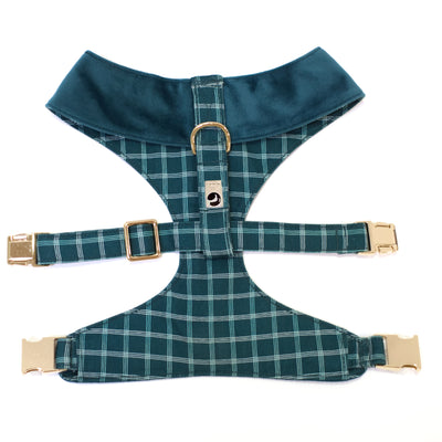 Top back view of dark teal reversible dog harness with gold hardware in velvet and windowpane plaid