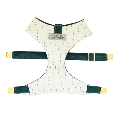 Front view of reversible dog harness with gold hardware in light green with dark green arrows