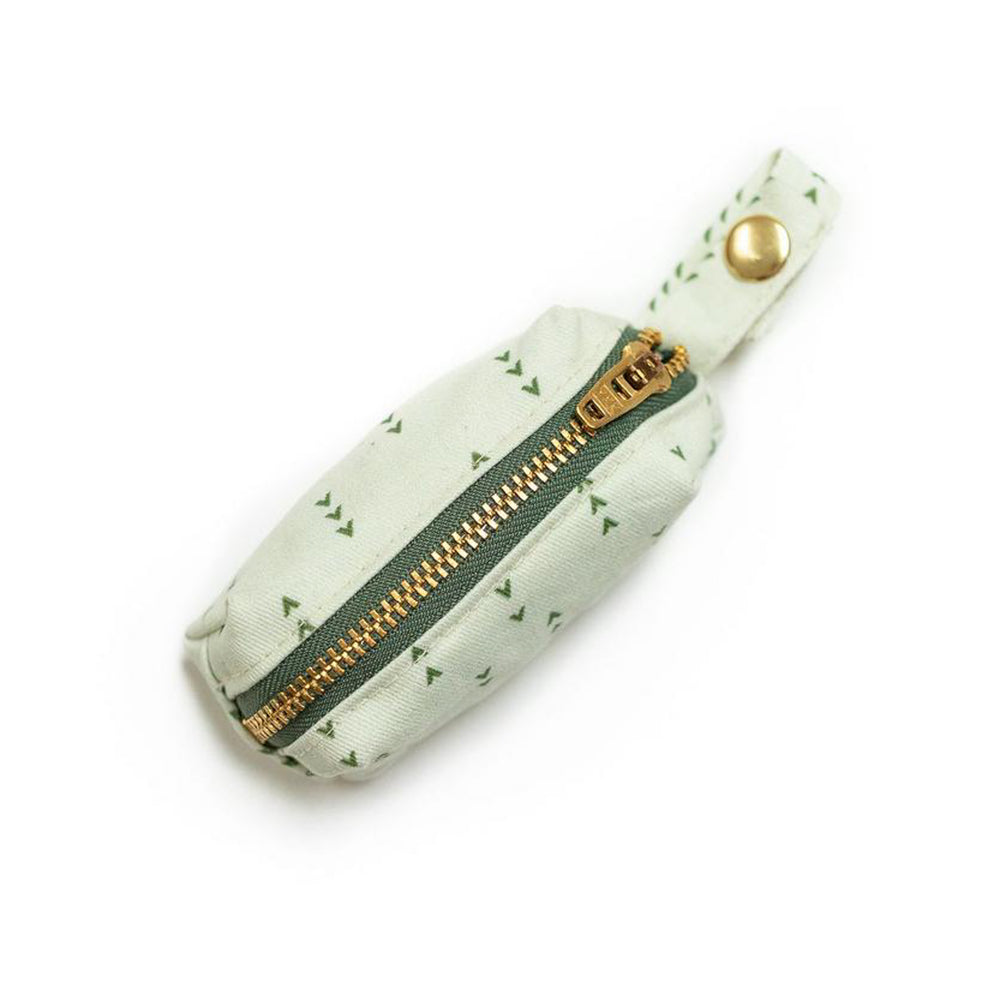 Top  view of fabric rectangular pouch with zip closure and snap loop for poop bags in light green with dark green arrows