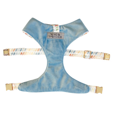 Front view of reversible dog harness with gold hardware in dusty blue velvet