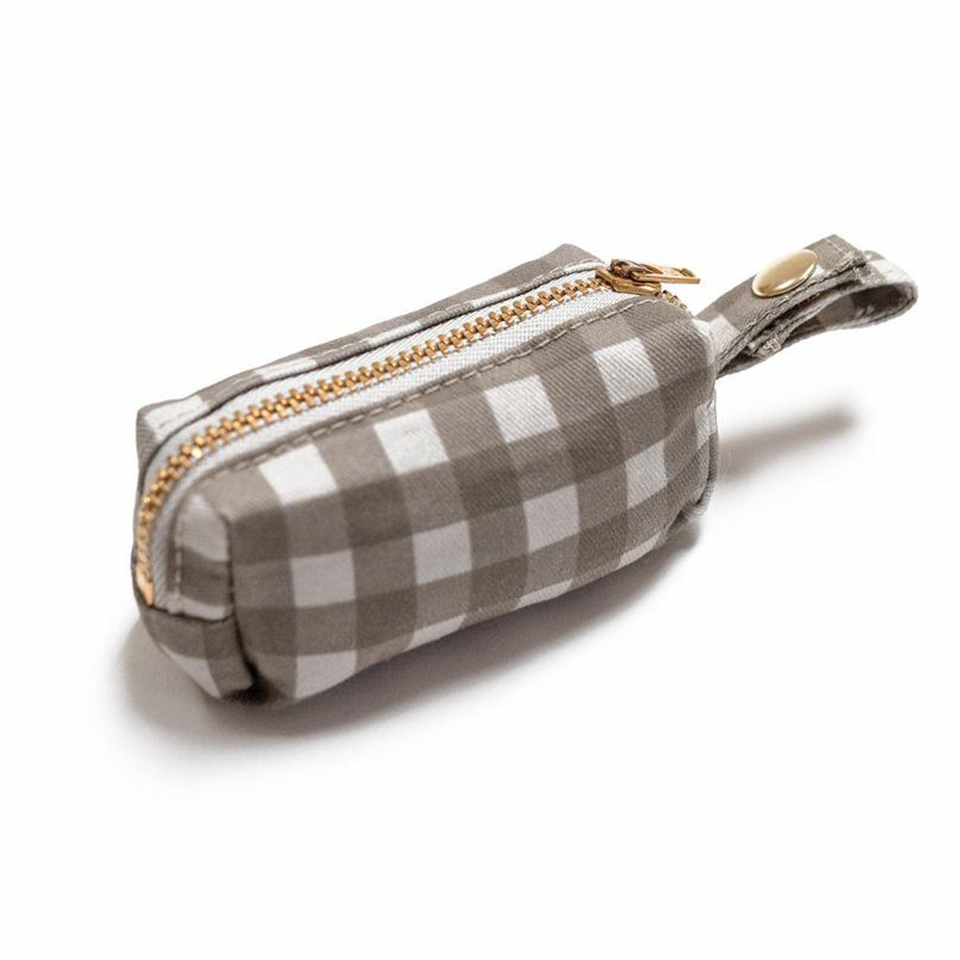 Side view of fabric rectangular pouch with zip closure and snap loop for poop bags in gray buffalo check