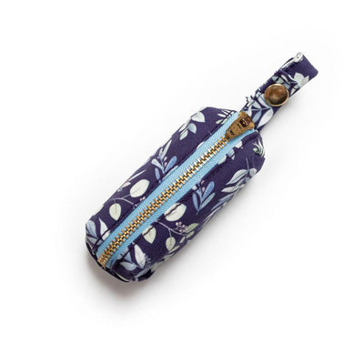 Top  view of fabric rectangular pouch with zip closure and snap loop for poop bags in indigo background with multi-color foliage