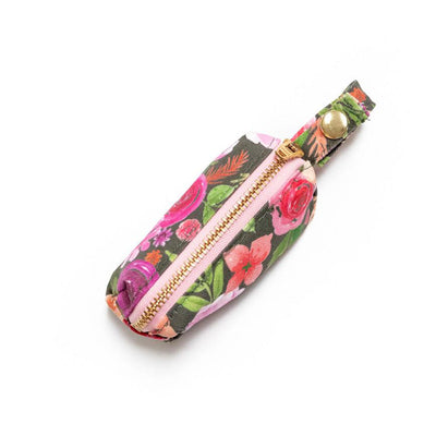 Top  view of fabric rectangular pouch with zip closure and snap loop for poop bags in pink multi floral on gray