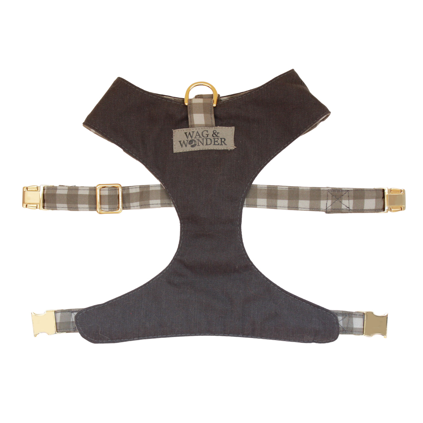 Front view of reversible dog harness with gold hardware in dark gray