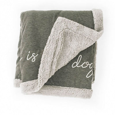 Dark gray Fleece blanket with The Doggy Snuggle is Real embroidered on front and light gray Sherpa back side folded with corner back