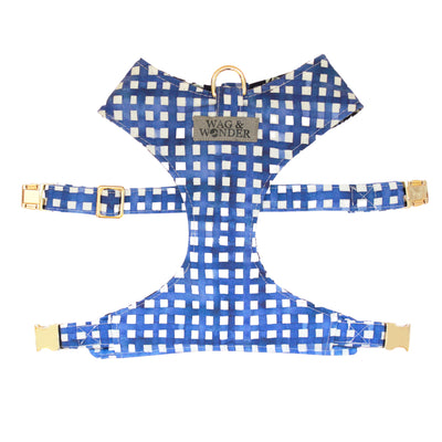Front view of reversible dog harness with gold hardware in navy watercolor plaid