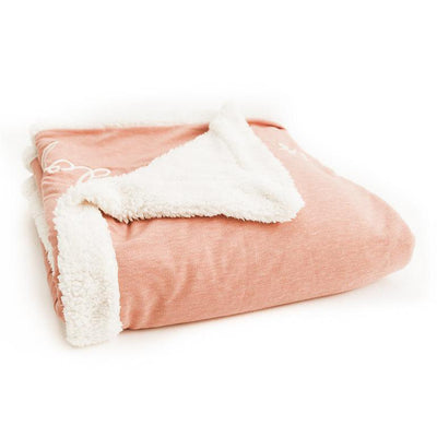 Blush fleece blanket with The Doggy Snuggle is Real embroidered on front and natural Sherpa back side folded from side